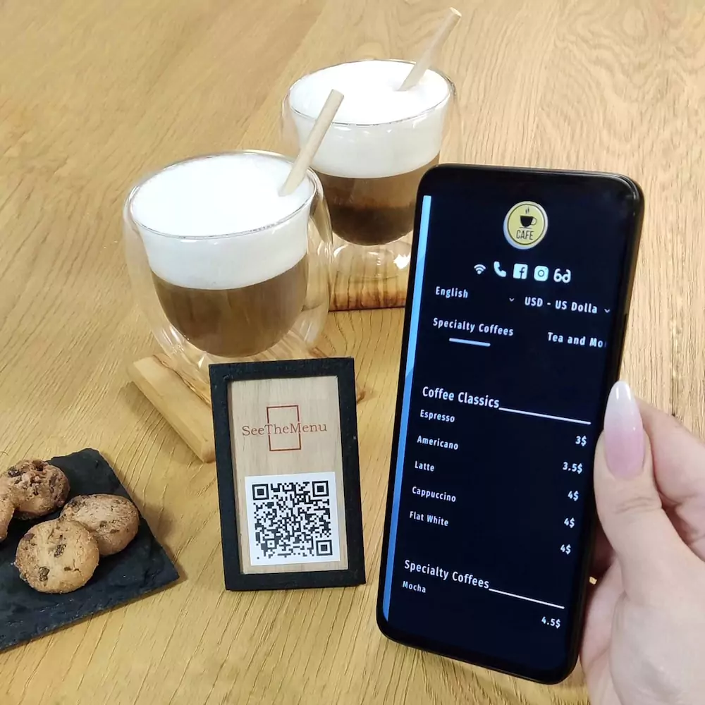 A table with a QR digital menu open on a phone